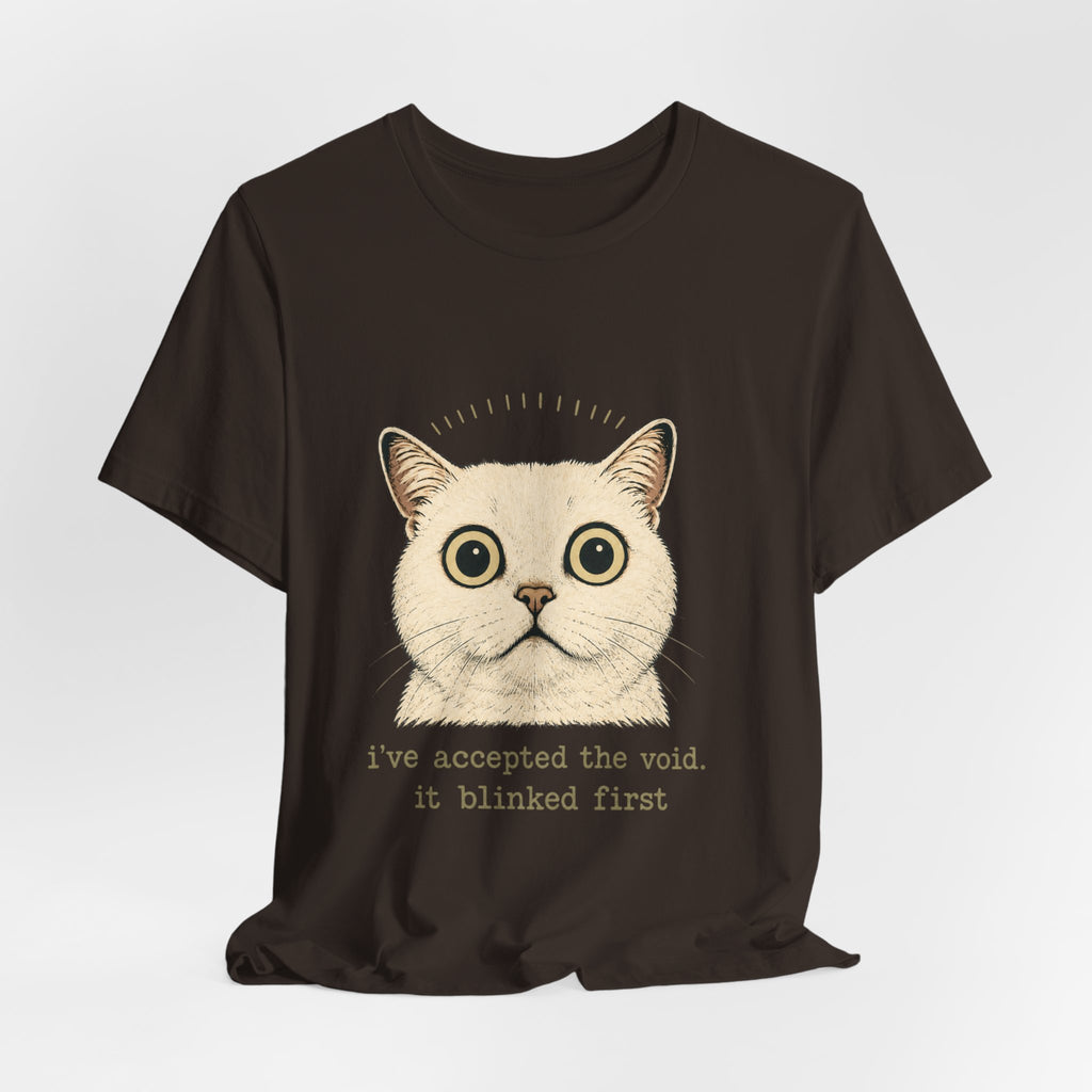 Dark brown Halloween cat T-shirt with funny quote 'i've accepted the void. it blinked first' — perfect spooky cat lover gift